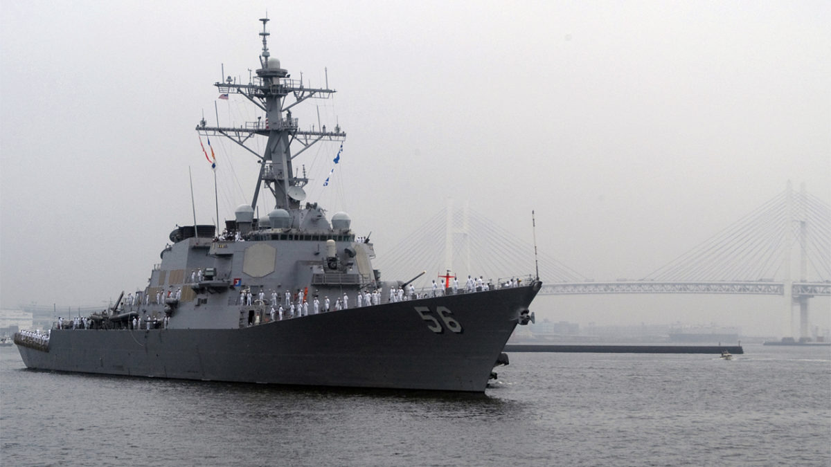 The forward-deployed guided-missile destroyer USS John S. McCain (DDG 56) approaches Osanbashi Pier in the Port of Yokohama, Japan