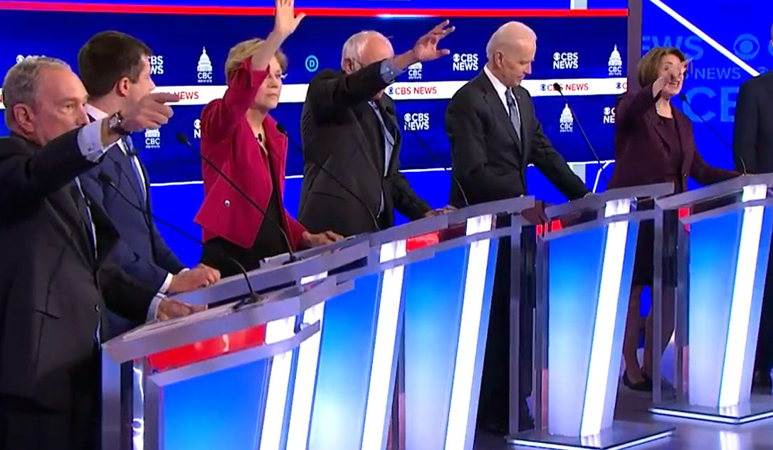Democrats raise their hands attempting to speak in chaotic Democratic Debate (via screenshot)