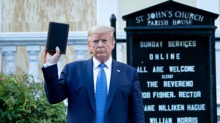 US President Donald Trump holds a Bible while visiting St. John's Church across from the White House