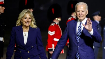 NEWQUAY, ENGLAND - JUNE 09: U.S. President Joe Biden and first lady Jill Biden react upon arrival at Cornwall Airport on June 9, 2021 near Newquay, Cornwall, England. On June 11, Prime Minister Boris Johnson will host the Group of Seven leaders at a three-day summit in Cornwall, as the wealthiest nations look to chart a course for recovery from the global pandemic. (Photo by Phil Noble - WPA Pool/Getty Images)