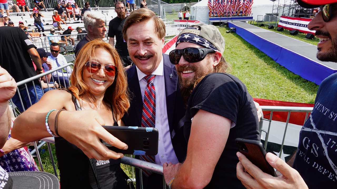 WELLINGTON, OHIO - JUNE 26: Supporters of former President Donald Trump take a selfie with My Pillow founder Mike Lindell as they wait for the start of a rally at the Lorain County Fairgrounds on June 26, 2021 in Wellington, Ohio. Trump is in Ohio to campaign for his former White House advisor Max Miller. Miller is challenging incumbent Rep. Anthony Gonzales in the 16th congressional district GOP primary. This is Trump's first rally since leaving office. 