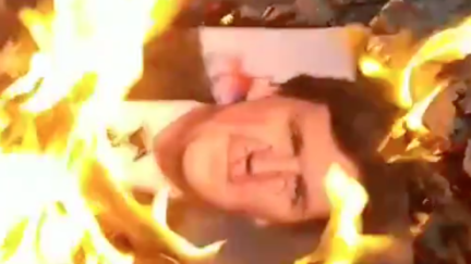 American flag and Tucker Carlson Picture Burned Outside Fox News HQ