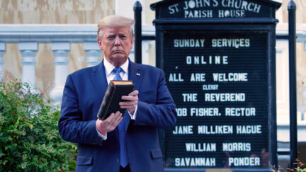 Donald Trump holds a Bible while visiting St. John's Church across from the White House after the area was cleared of people protesting the death of George Floyd