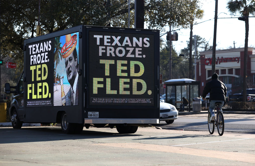 texans froze ted cruz fled digital billboard truck sign