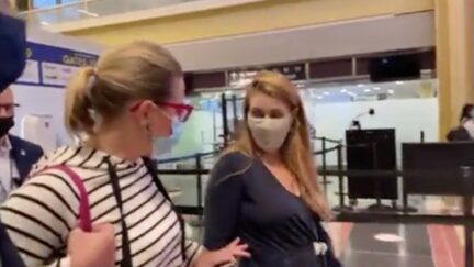Woman confronts Kyrsten Sinema at airport