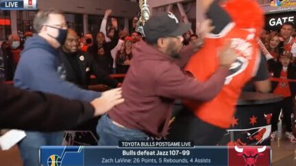 Chicago Bulls fan gets shoved off postgame set