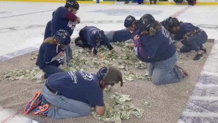 Teachers Scrounge for Cash at Hockey Game