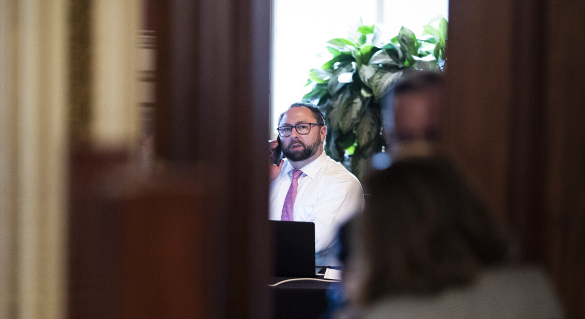 ason Miller works in a meeting room for lawyers of former President Donald Trump on the fourth day of the Senate Impeachment trials for former President Donald Trump.