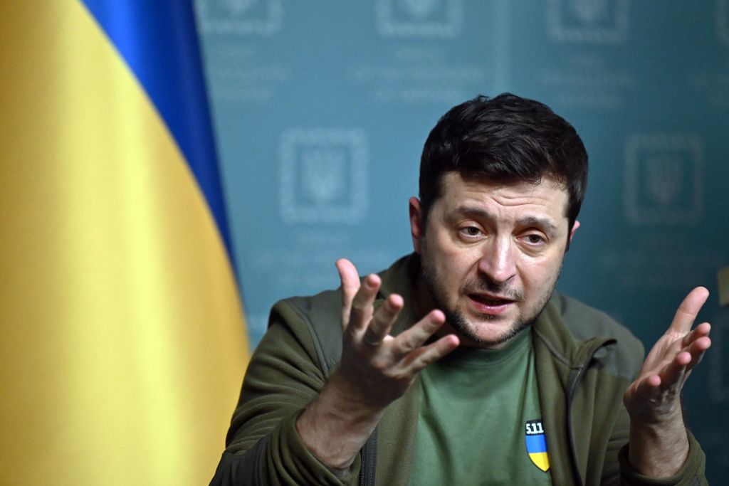 Ukrainian President Volodymyr Zelensky press conference with flag in background