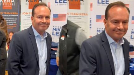 Mike Lee runs from reporter
