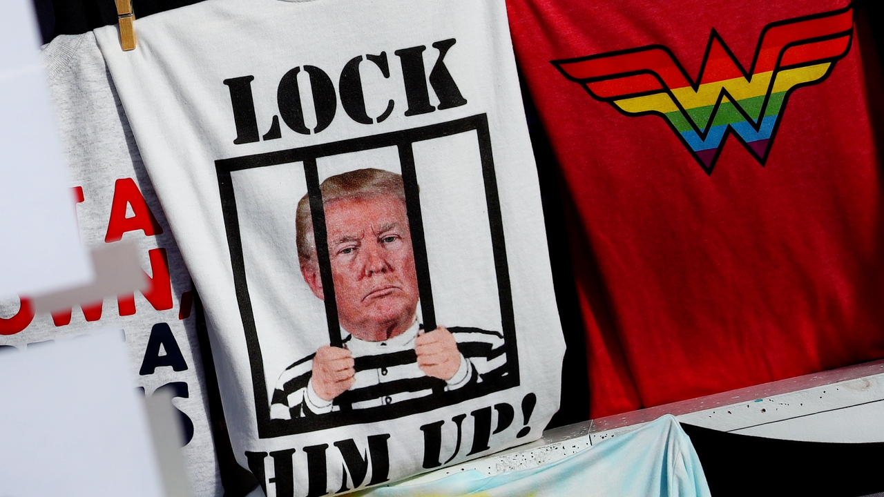 A "Lock Him Up!" shirt for sale Commercial Street on May 25, 2020 in Provincetown, Massachusetts. Massachusetts has begun Phase 1 of reopening after the coronavirus (COVID-19) shutdown. Beaches reopened and non essential businesses were allowed to operate with curbside pickup.
