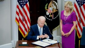 US First Lady Jill Biden looks on as US President Joe Biden signs the Bipartisan Safer Communities Act into law, in the Roosevelt Room of the White House in Washington, DC, on June 25, 2022. (Photo by Stefani Reynolds / AFP) (Photo by STEFANI REYNOLDS/AFP via Getty Images)