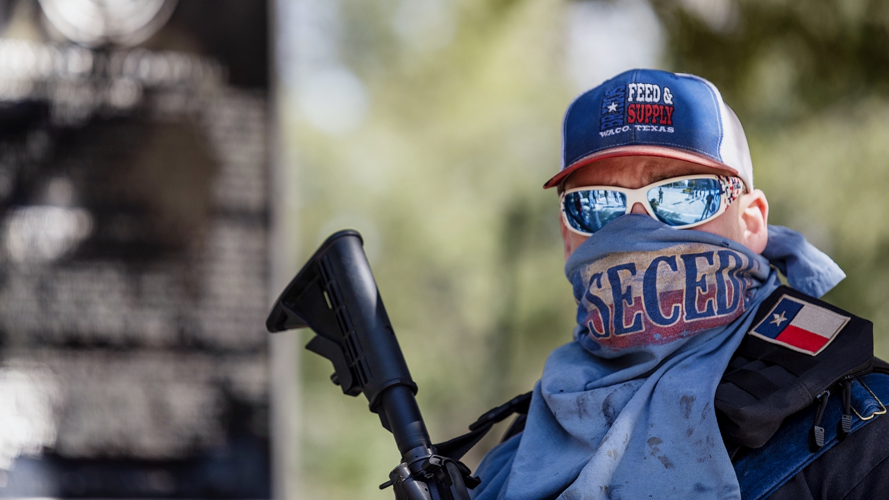 AUSTIN, TX - JANUARY 16: A man wears a face covering that reads "secede" outside the Texas state capitol on January 16, 2021 in Austin, Texas. Supporters of President Trump gathered at state capitol buildings throughout the nation today to protest the presidential election results and the upcoming inauguration of President-elect Joe Biden. (Photo by Sergio Flores/Getty Images)