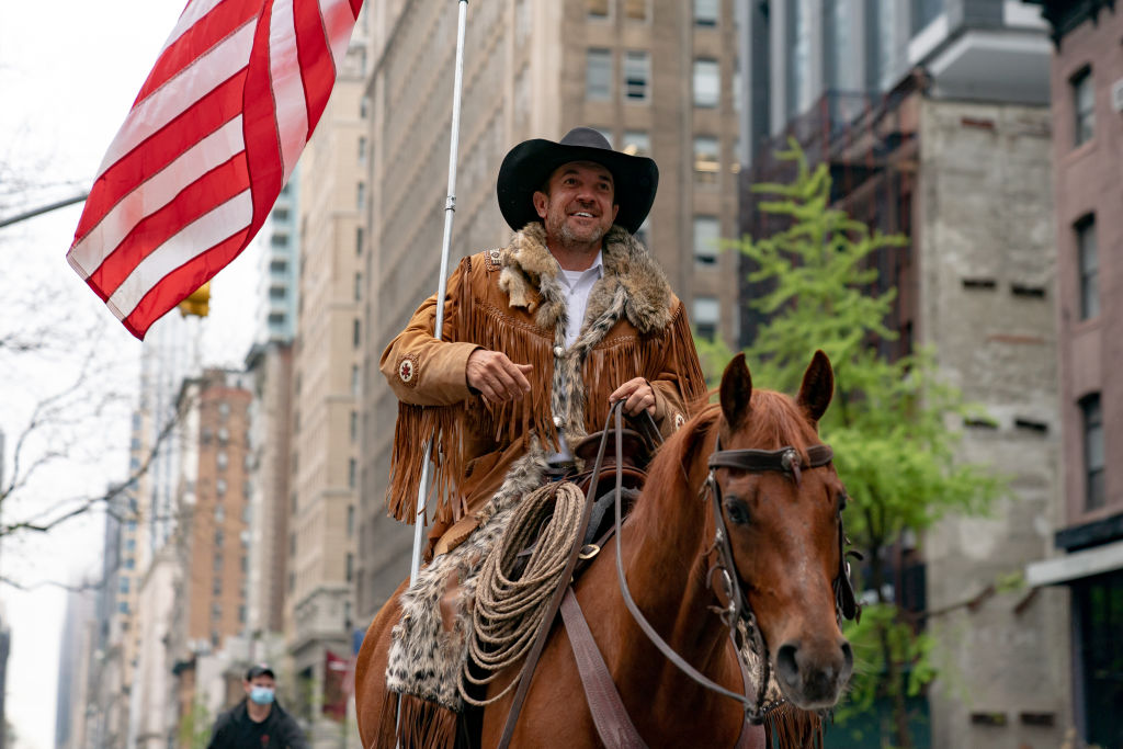 Otero County Commission Chairman and Cowboys for Trump co-founder Couy Griffin rides his horse on 5th avenue 