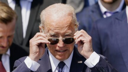 President Joe Biden puts on his sunglasses as he speaks during an event to celebrate the Tampa Bay Lightning's 2020 and 2021 Stanley Cup championships at the White House, Monday, April 25, 2022, in Washington.
