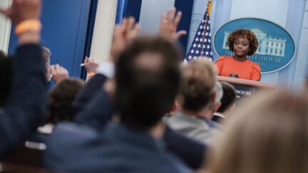 Reporters raise their hands for questions as White House Press Secretary Karine Jean-Pierre speaks during a daily press briefing in the James S. Brady Press Briefing Room at the White House in Washington, DC on August 29, 2022.