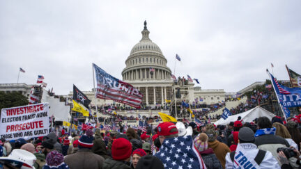 FILE - Insurrectionists loyal to President Donald Trump storm the U.S. Capitol in Washington on Jan. 6, 2021. On Tuesday, Jan. 17, 2023, Hatchet Speed, a Navy reservist who is charged with storming the Capitol on Jan. 6, went back to trial in Virginia on separate charges that he illegally bought silencers — and talked about using them against Jewish people and others he considered to be enemies. (AP Photo/Jose Luis Magana, File)