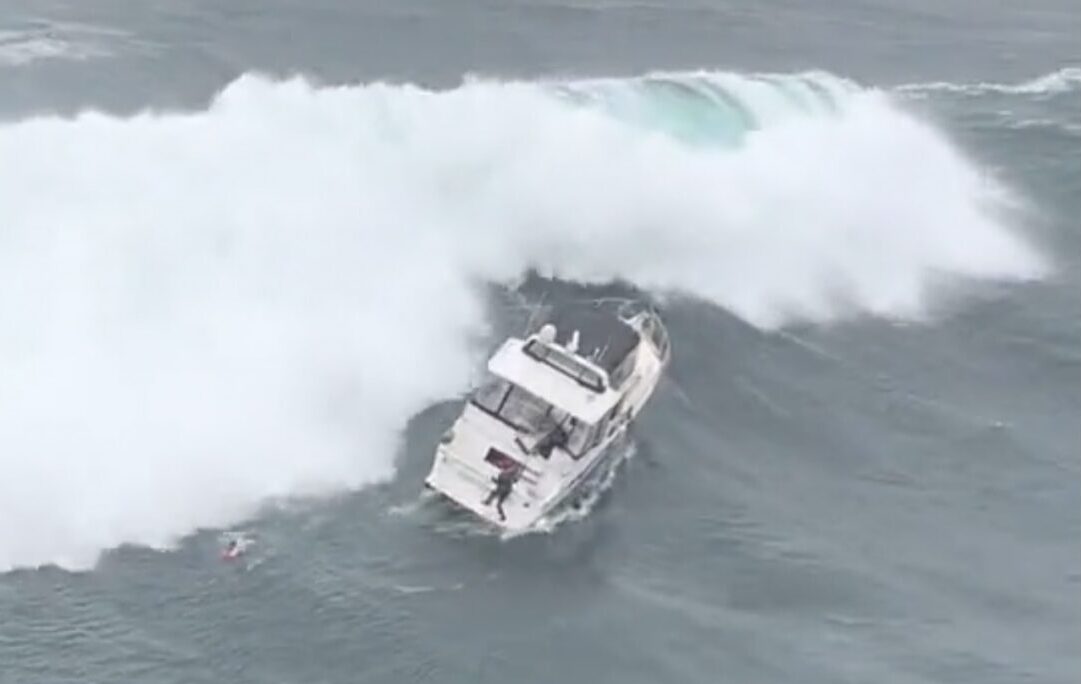 WATCH: Absolutely Insane Footage Shows Coast Guard Rescuing Man Who Hopped Out of Boat an Instant Before it was Toppled By Massive Wave