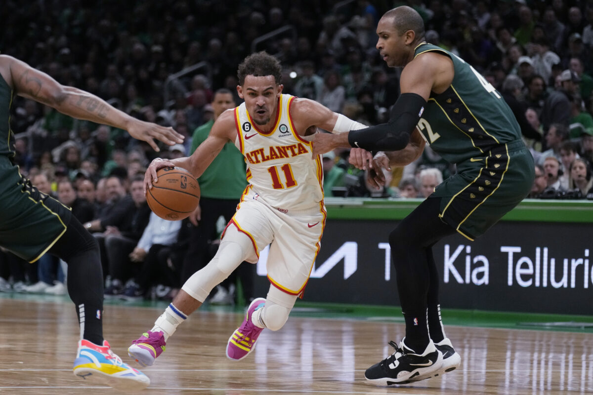 Trae Young being guarded by Al Horford