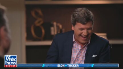 Tucker Carlson laughing