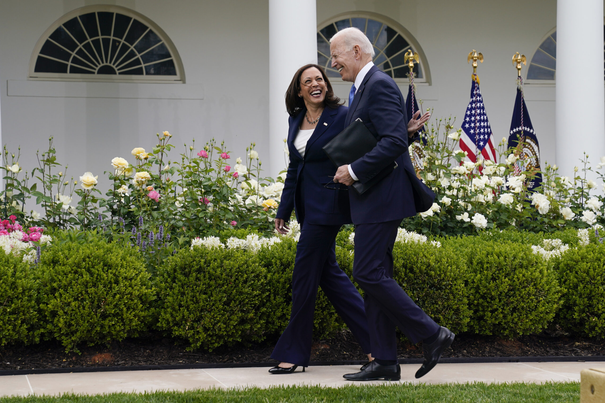 FILE - President Joe Biden walks with Vice President Kamala Harris after speaking on updated guidance on face mask mandates and COVID-19 response, in the Rose Garden of the White House, May 13, 2021, in Washington. Harris is capping off a controversial first year in office, creating history as the first woman of color in her position while fending off criticism and complaints over her focus and agenda. While she’s sought to make the office her own, Harris has struggled at times with the constraints of a global pandemic and the realities of a role focused squarely on promoting the president.