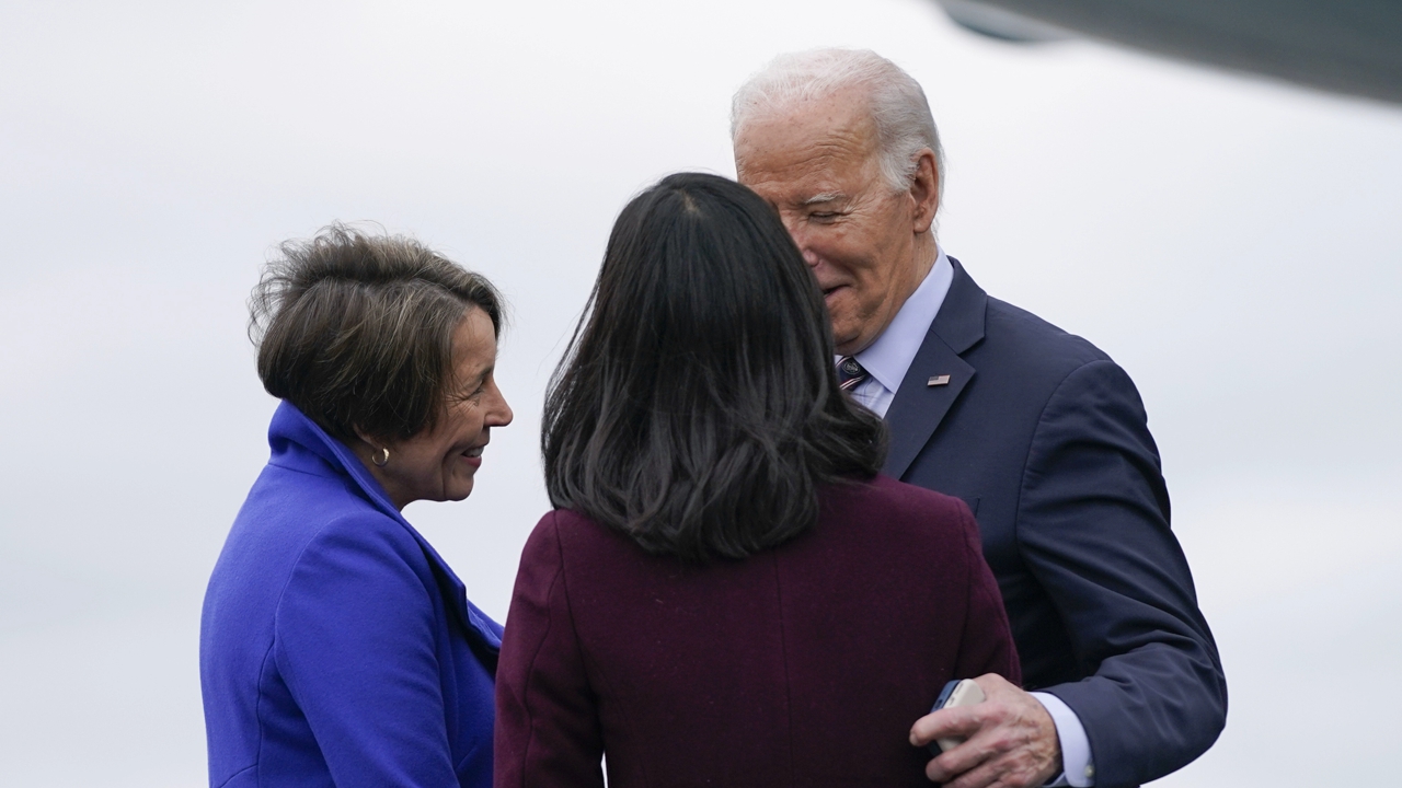 President Joe Biden is greeted by Massachusetts Gov. Maura Healey, left, and Boston Mayor Michelle Wu as he arrives at Boston Logan International Airport to attend several campaign fundraisers, Tuesday, Dec. 5, 2023, in Boston. 