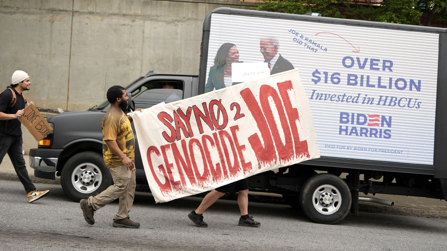 People protest near the commencement at Morehouse College, Sunday, May 19, 2024, in Atlanta. 