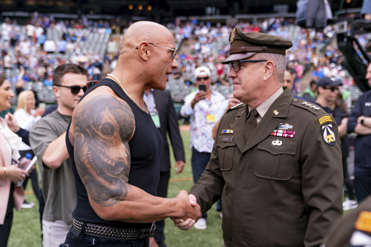 Dwayne "The Rock" Johnson with military serviceman