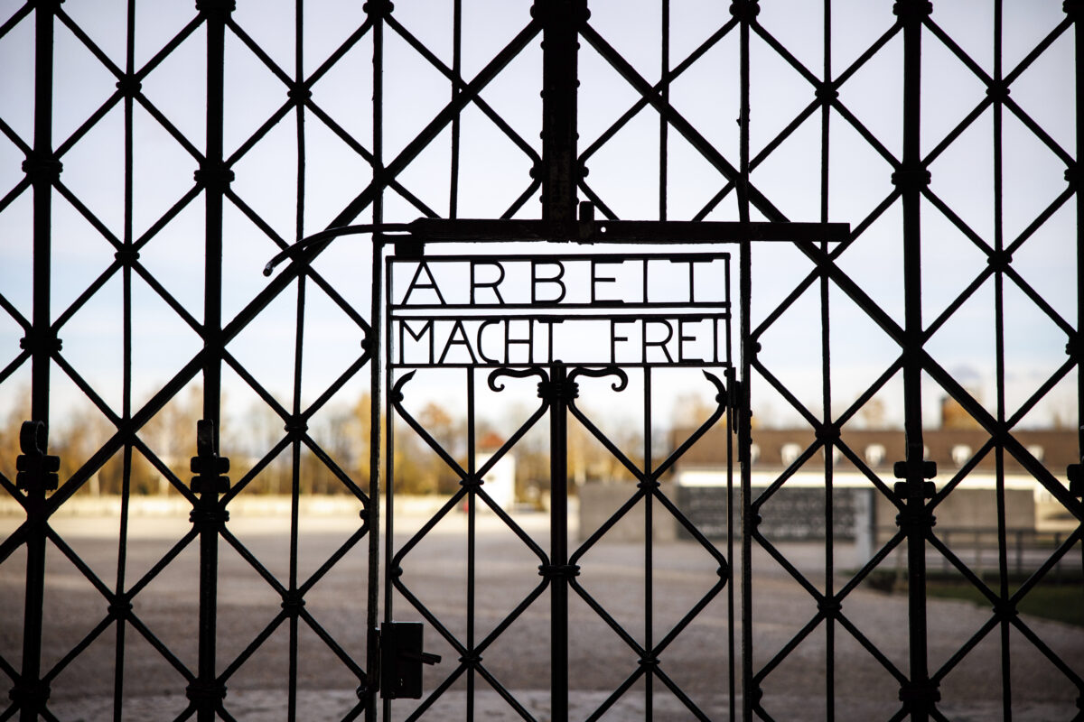Entrance gate at Dachau concentration camp in Germany showing "Arbeit Macht Frei"