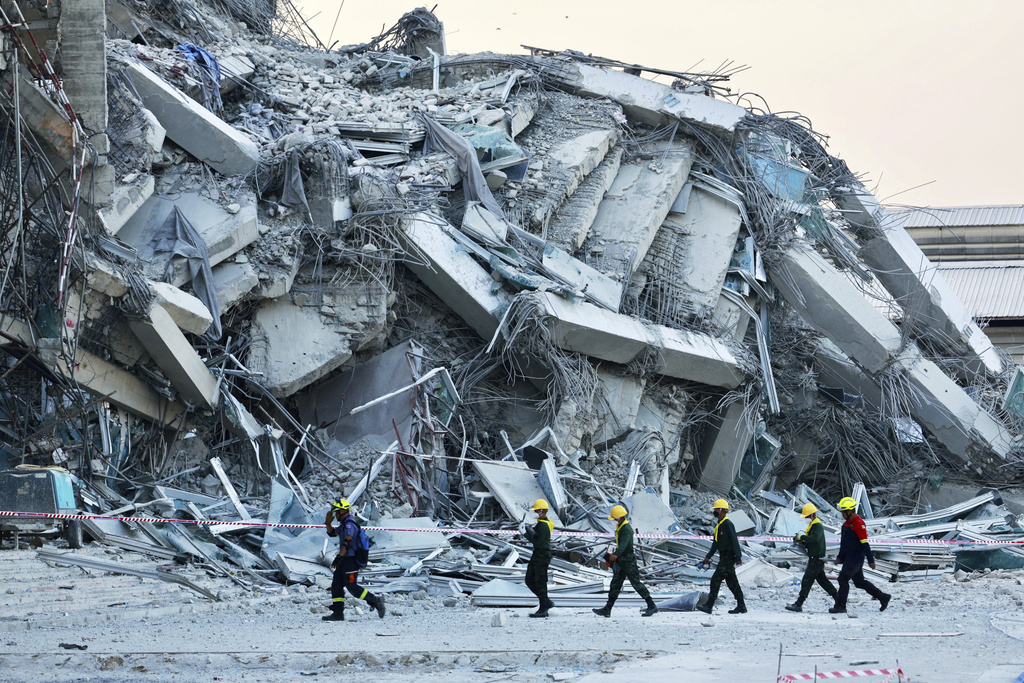 Rescuers work at the site a high-rise building under construction that collapsed after a 7.7 magnitude earthquake in Bangkok, Thailand, Friday, March 28, 2025. (AP Photo/Wason Wanichakorn)