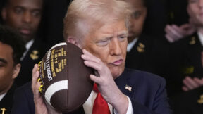 Donald Trump holding a football