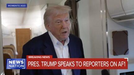 Donald Trump speaks to press on Air Force One