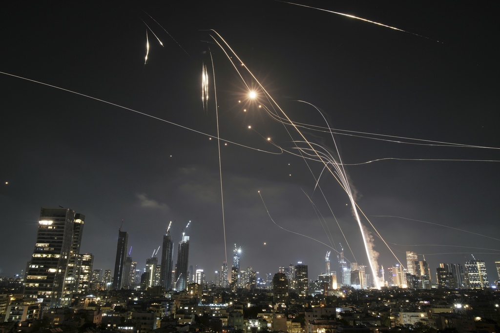 Israeli Iron Dome air defense system fires to intercept missiles over Tel Aviv, Israel, Friday, June 13, 2025.