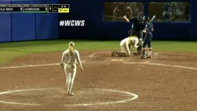 Softball hits clump of dirt mid-air into catcher's eye
