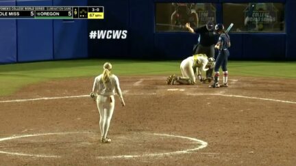 Softball hits clump of dirt mid-air into catcher's eye