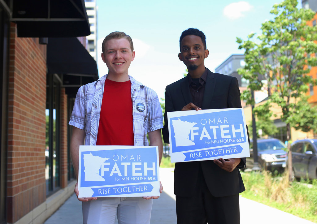 In this June 1, 2018, photo, University student Austin Berger, left, poses for a portrait with Omar Fateh, who is running for the Minnesota House of Representatives in Dinkytown, Minn. Berger and other student staffers created a unionization campaign based on Rep. Erin Murphy's campaign for governor.