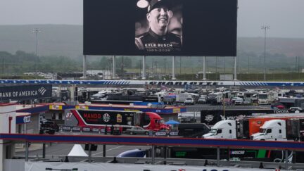 An in memoriam photo of former driver Kyle Busch is displayed on the video board of the backstretch at Charlotte Motor Speedway