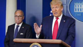 President Donald Trump speaks during a news briefing at the White House, Thursday, July 2, 2020, in Washington, as White House chief economic adviser Larry Kudlow looks on.