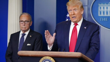 President Donald Trump speaks during a news briefing at the White House, Thursday, July 2, 2020, in Washington, as White House chief economic adviser Larry Kudlow looks on.