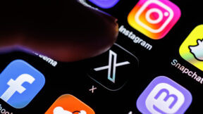 07 March 2026, Bavaria, Munich: The logo of the X app (formerly Twitter) can be seen on the display of a smartphone in Munich (Bavaria, Germany) on March 7, 2026, while a finger taps on the application icon. X is a social media network that was developed as a microblogging platform by Twitter Inc. The service was acquired in 2022 by X Corp, a company majority-controlled by Musk. (pointing finger, icon, symbol image, symbol photo, illustration, symbolic photo, illustrative photo, theme image, general image, theme photo) Photo by: Matthias Balk/picture-alliance/dpa/AP Images