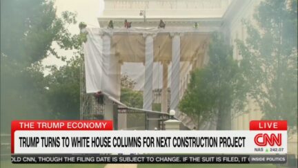 Tarp depicting renovated columns on the white house's north portico is unfurled covering the north portico