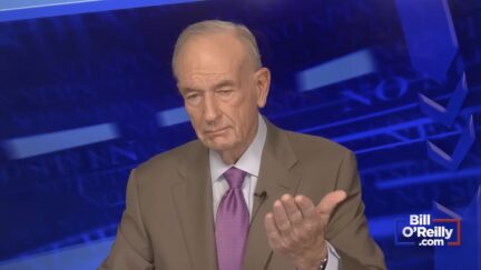 bill o'reilly on his podcast in a brown suit with a blue background