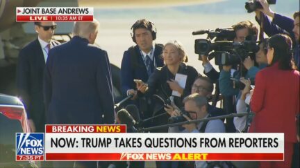 Reporters speak to trump on the tarmac