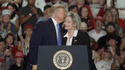 trump kisses hyde smith at rally